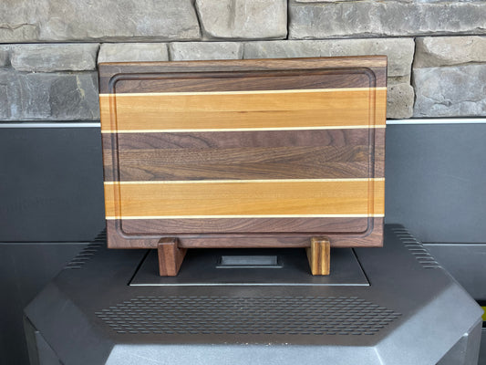 Edge Grain Walnut Cutting Board with two Thick Cherry and Maple Accent stripes