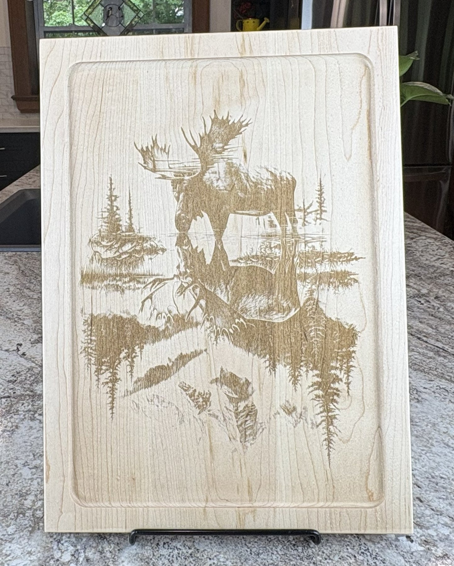 MOOSE STANDING IN A RIVER